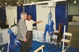 Dick Carlson, BRS Bureau Chief, learns about the lift system from Charlie Liu of Able Dynamics
